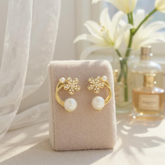 Gold toned pearl and flower studs